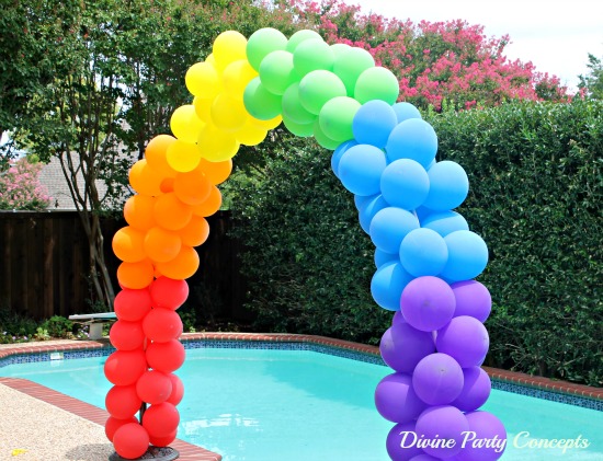 rainbow colored balloon arch for sweet 16 parties